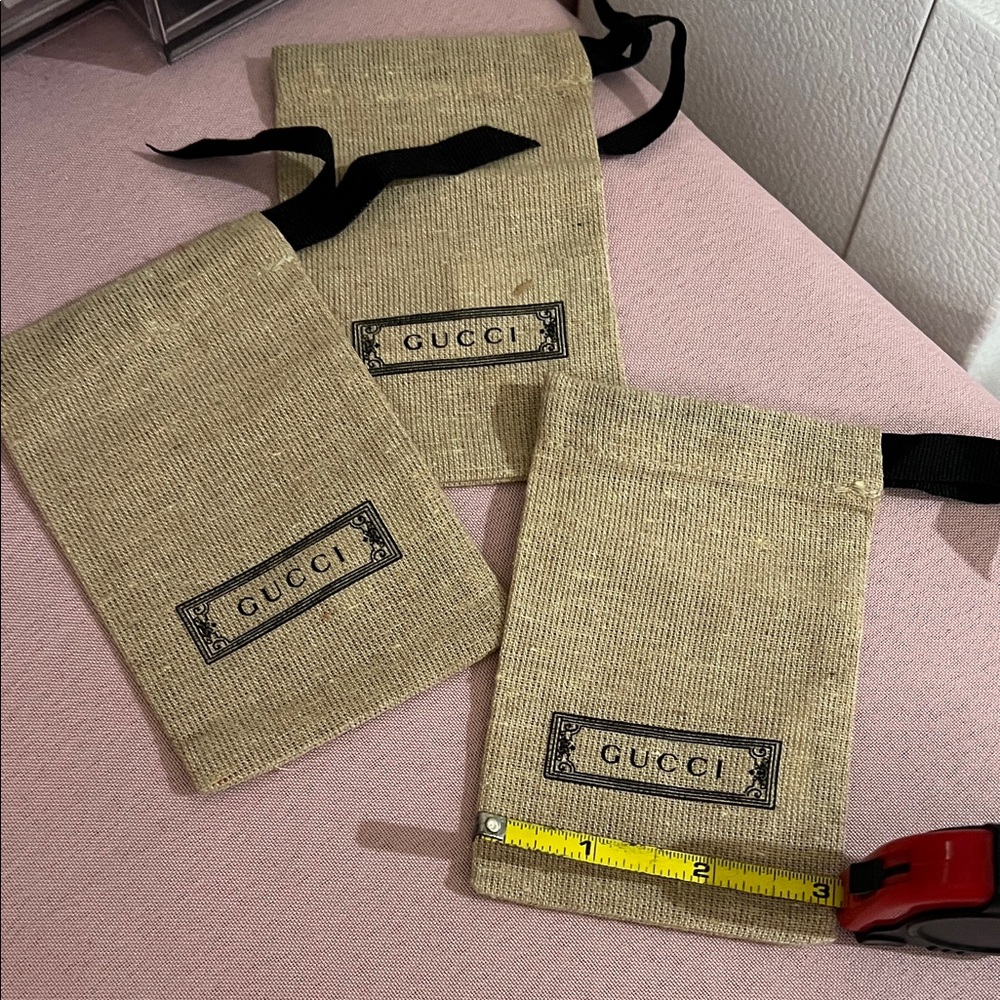 3 Gucci Tan Drawstring Bags